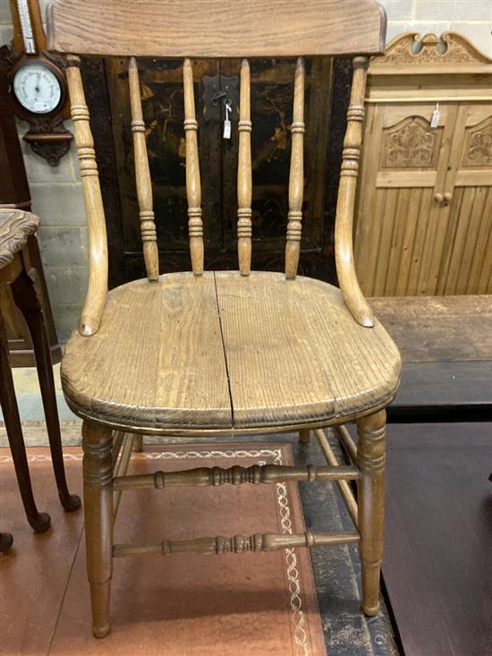 A nest of three walnut tea tables and a pair of early 20th century ash comb back dining chairs